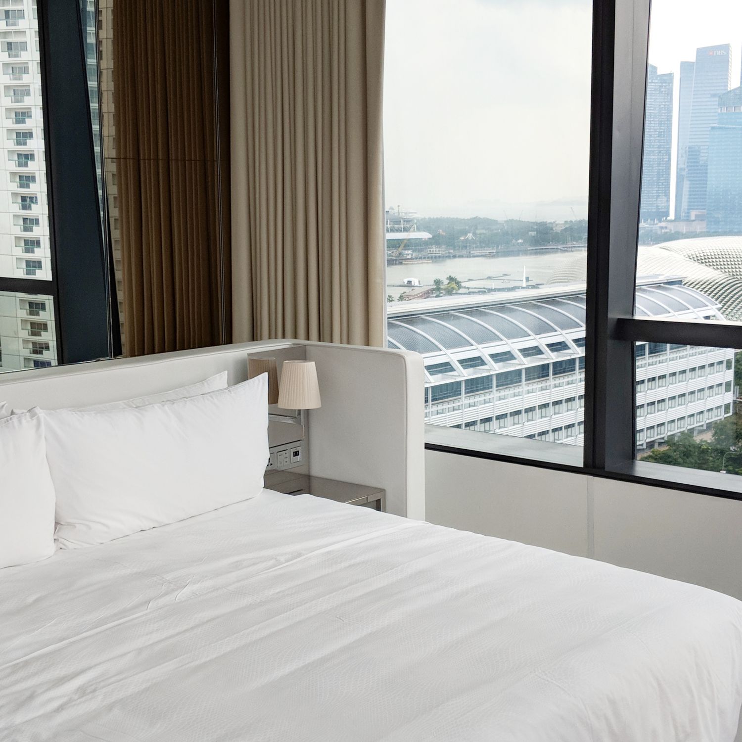jw marriott singapore south beach executive suite with premier marina bay view bedroom
