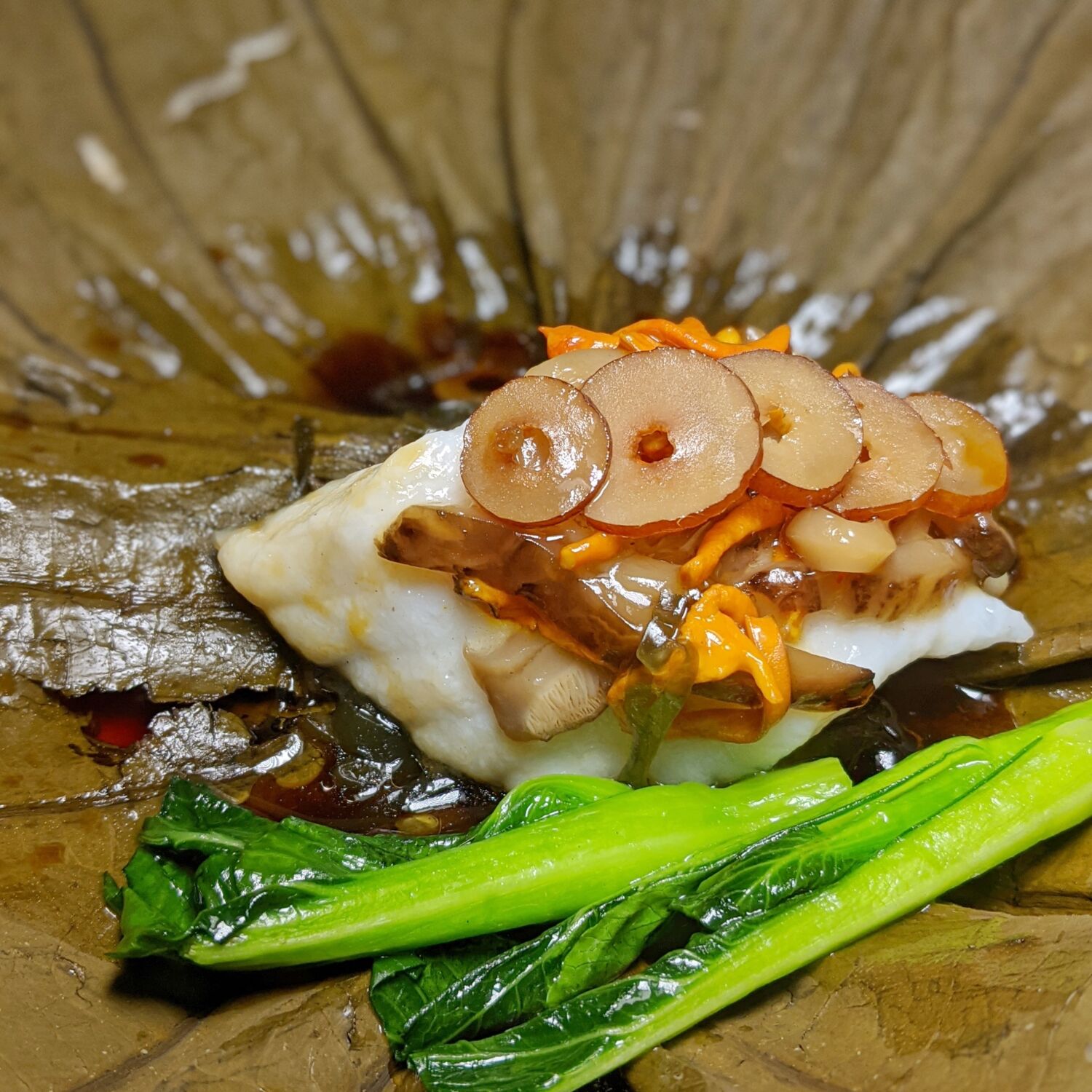Mandarin Orchard Singapore Shisen Hanten Steamed East-spotted Grouper with Kelp, Red Date, Cordyceps and Mushroom in Superior Soya Sauce Wrapped in Lotus Leaf